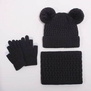 Detailed knit texture of winter hat scarf and touchscreen gloves set in black