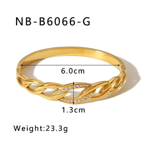 Detail of twisted gold bangle with double-row rhinestones and 6.0cm diameter measurements