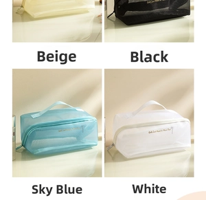 Mesh makeup bags in four colors featuring top handles and stylish typography