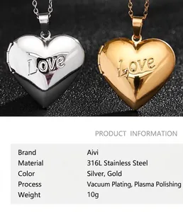 Macro shot of 316L stainless steel heart locket in gold and silver with Love engraving