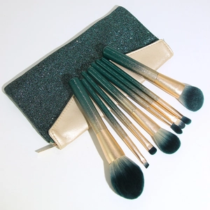 8-piece green gradient makeup brush set with a sparkly glitter storage pouch