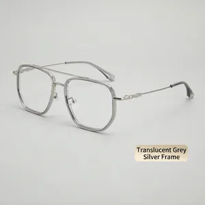 Detail of silver double bridge glasses with transparent grey frame accents