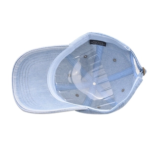 Internal view of light blue washed denim baseball cap with 100% cotton inner lining