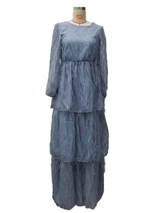 Detailed view of the foggy blue tiered dress featuring unique feather-like fabric texture