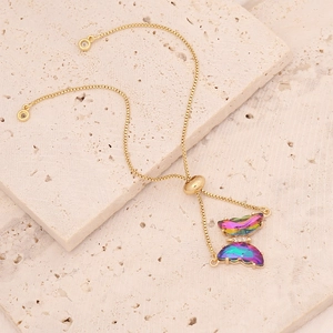 Detailed shot of an 18K gold butterfly bracelet with colorful zircon and pull-string clasp