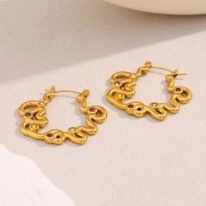 Detailed shot of 18K gold plated twisted hoop earrings with multicolored zircons