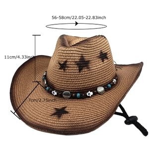 Detail of western straw cowboy hat featuring ethnic beads and engraved metal charm