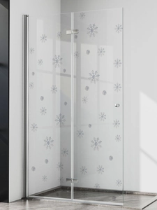 Detail of snowflake pattern on a chrome frame folding glass shower door in bathroom