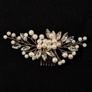 Handmade bridal hair comb with gold wire pearls and marquise crystals on black background