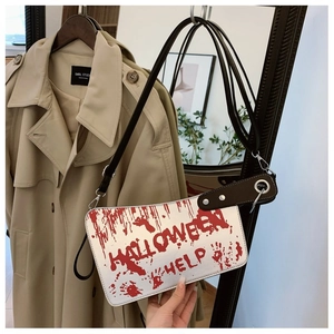 Detail of white Halloween bag with red blood splatter print and HALLOWEEN HELP text