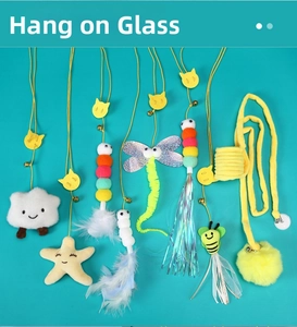 Hanging cat toy set with suction cup, bells, and colorful feathers for glass windows