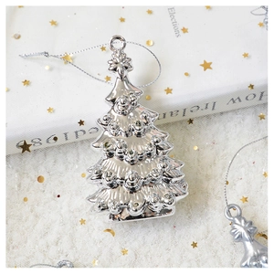 Close-up of a silver Christmas tree ornament with textured finish and silver hanging cord