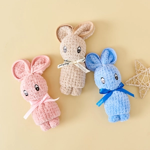 Three coral fleece bunny-shaped towels in pink, beige, and blue with soft plush texture