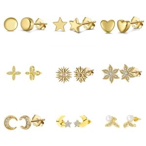 Collection of nine S925 sterling silver gold stud earrings in diverse geometric shapes
