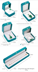 Green leather jewelry boxes with gold crown logos and white velvet interior for accessories