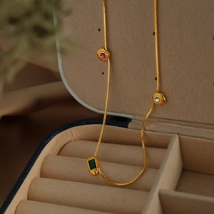 Vintage 18K gold plated snake chain necklace with green, red, and white zircon gemstones