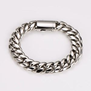 Detailed close-up of a silver polished stainless steel Cuban link bracelet with a secure clasp