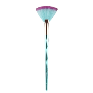 Detail of fan highlighter brush with blue geometric handle and purple gradient bristles