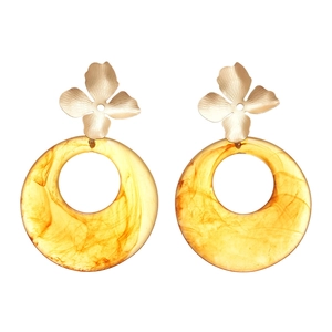 Modern resin hoop earrings with golden floral studs and translucent yellow rings