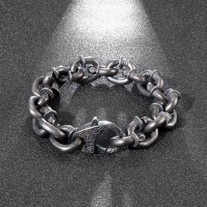Macro detail of industrial vintage nail link bracelet in distressed stainless steel