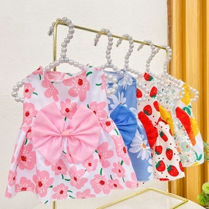 Floral pet summer dresses with bows on pearl hangers featuring daisies and strawberries