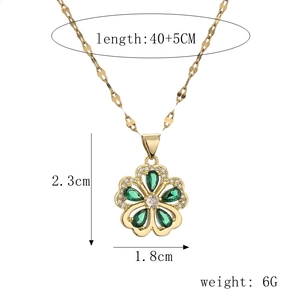 Detail view of five-petal flower necklace with green stones and dimensions 2.3x1.8cm