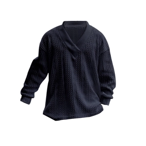 Close-up of navy blue V-neck knit sweater featuring classic cable knit texture and pattern
