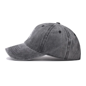 Detail view of washed cotton baseball cap with vintage embroidery and stitching