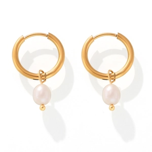 Macro shot of 18k gold plated hoop earrings with elegant white hanging pearls