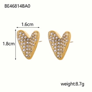Detail shot of gold heart earrings with rhinestones measuring 1.6cm by 1.8cm