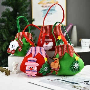 Detail of Christmas gift bags with 3D Santa and reindeer dolls on festive background