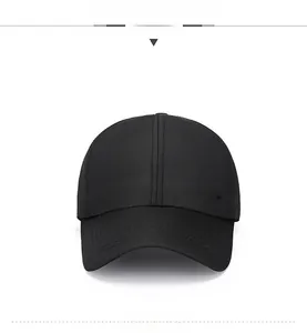 Detail of classic black baseball cap with embroidered lettering and mesh fabric texture