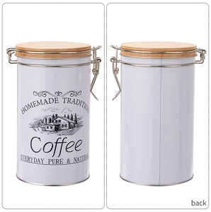 Detail view of white tinplate coffee canister with bamboo lid and metal airtight lock
