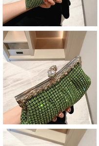 Detail of green crystal rhinestones on luxury evening clutch with silver ball clasp