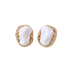 Vintage gold oval earrings with ivory resin and small sparkling zircon accents