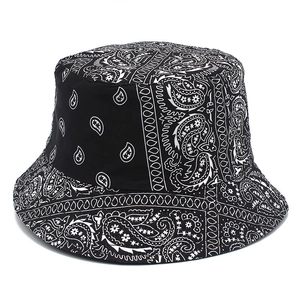 Reversible black and white paisley bucket hat with classic cotton fabric and sun protection