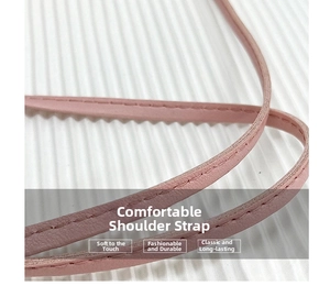 Detailaufnahme rosa Leder-Schultergurte mit Präzisionsnähten und weicher Textur