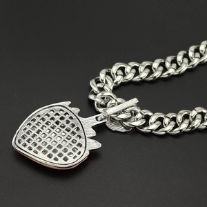 Detail of S925 engraved stamp on strawberry heart pendant with cuban chain back