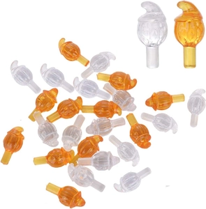 Scattered transparent and orange plastic flame replacement bulbs for ceramic Christmas trees