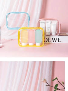 Detailed view of large PVC waterproof toiletry bags in blue, yellow, and pink colors