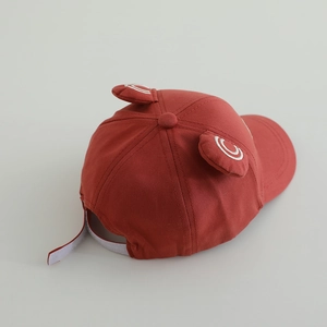 Detail view of red toddler baseball cap with cute 3D ears and adjustable back strap