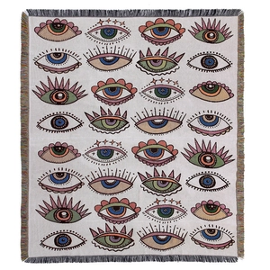 Bohemian evil eye woven outdoor camping blanket with colorful geometric patterns and fringe