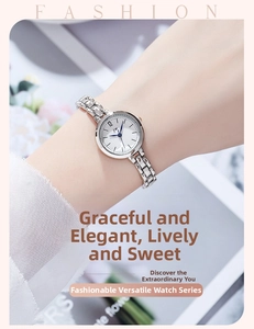 Detail of minimalist silver quartz watch with chain band and white round dial for women