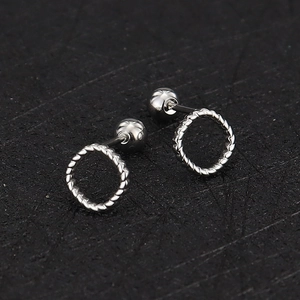 Detail of silver twisted rope hoop earrings with secure screw-back ball closures