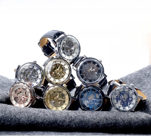 Multiple luxury skeleton mechanical watches with leather straps showing gears and Roman numerals