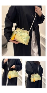 Detail view of floral brocade shell bag with pearl chain strap and silk tassel accent