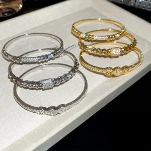18K gold plated zircon studded bangle set with intricate weave and hollow out designs