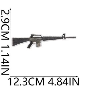 Detailed embroidery of an M16 assault rifle patch with size markings on white background