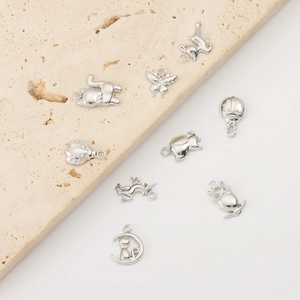 Artistic arrangement of animal-shaped stainless steel pendants for jewelry making