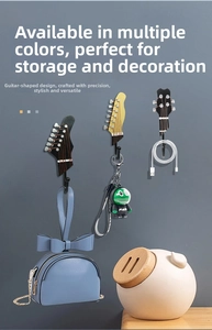 Detail showing resin guitar-shaped wall hooks in various colors for home decoration